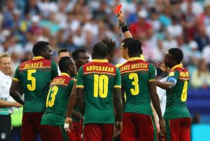 SOCHI, RUSSIA - JUNE 25:  Emest Mabouka of Cameroon is shown a red card by referee Wilmar Roldan after advice from the VAR during the FIFA Confederations Cup Russia 2017  Group B match between Germany and Cameroon at Fisht Olympic Stadium on June 25, 2017 in Sochi, Russia.  (Photo by Dean Mouhtaropoulos/Getty Images)