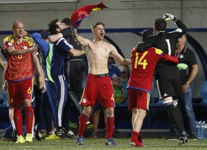 epa06019965 Andorra's players celebrate their victory during the FIFA Russia 2018 World Cup qualifying round soccer match between Andorra and Hungary in Andorra city, Andorra 09 June 2017.  EPA/GUILLAUME HORCAJUELO
