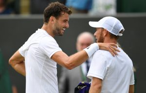 Tennis - Wimbledon - London, Britain - July 8, 2017 Israel’s Dudi Sela with Bulgaria’s Grigor Dimitrov after he retired from their third round match REUTERS/Tony O'Brien