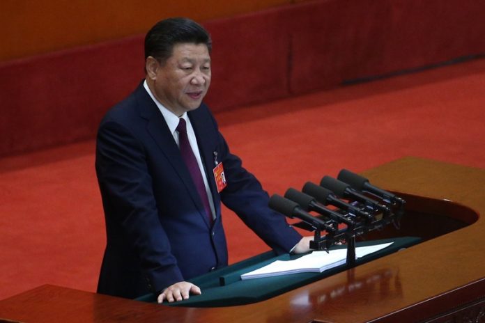 На снимката Си ДзинпинВ събота Китайската комунистическа партия избра нов