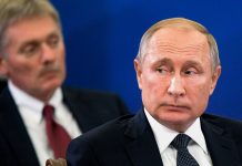 Руският президент Владимир Путин и говорителят на Кремъл Дмитрий Песков