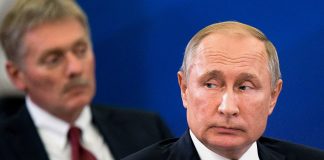 Руският президент Владимир Путин и говорителят на Кремъл Дмитрий Песков