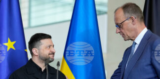 Президентът на Украйна Володимир Зеленски и германският канцлер Фридрих Мерц по време на срещата им в Берлин, 14 април 2026 г