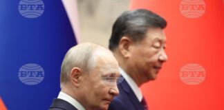 Руският президент Владимир Путин и Китайският му колега в Голямата зала на народа в Пекин, 20 май 2026 г.